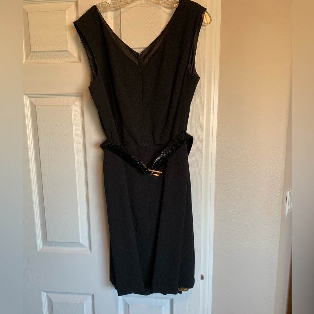 Tahari black dress 16. Fully lined, zipper back, belted.